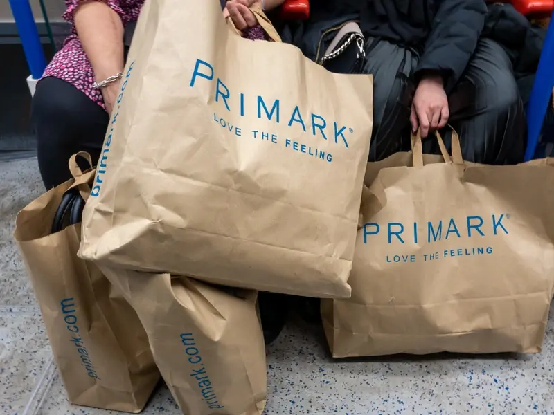 UK shoppers carrying Primark bags