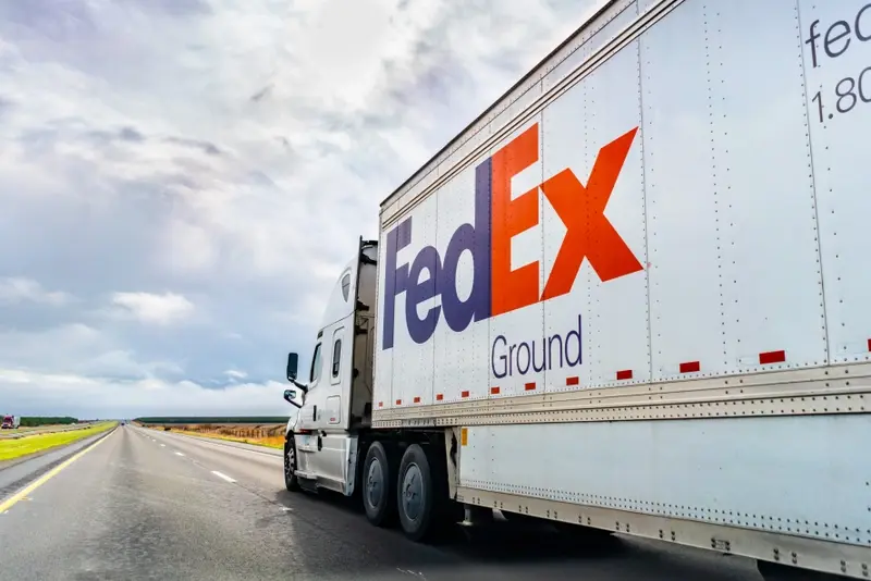 FedEx vehicle driving down an open road