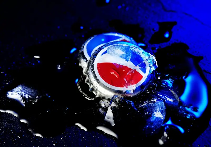 Pepsi bottle top in water