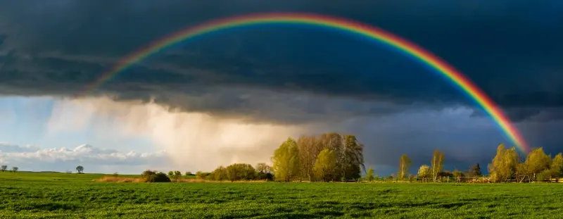 Rainbow on stormy sky
