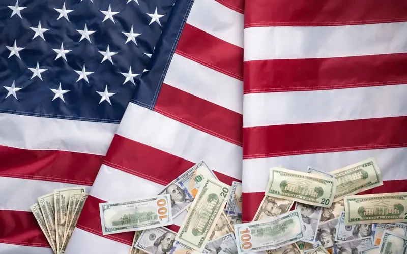 The American flag with US currency