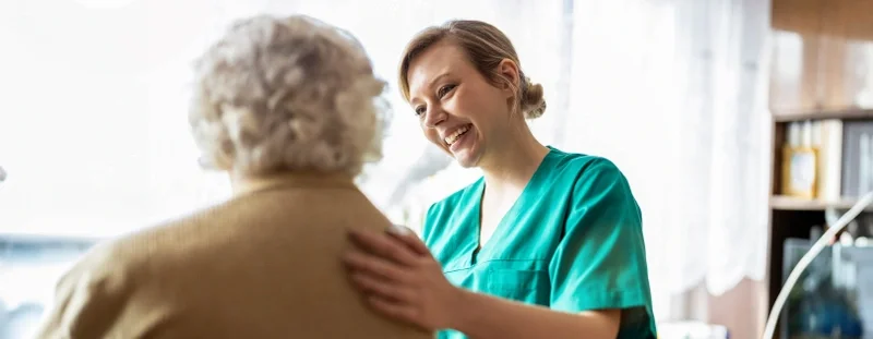 Nurse chatting to lady