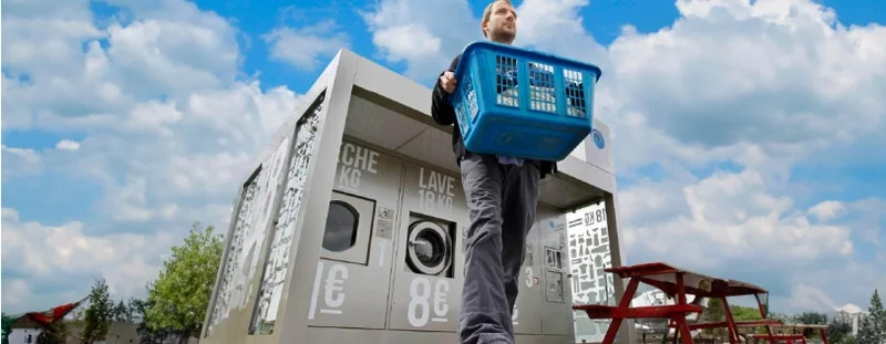 Man taking wash basket outside