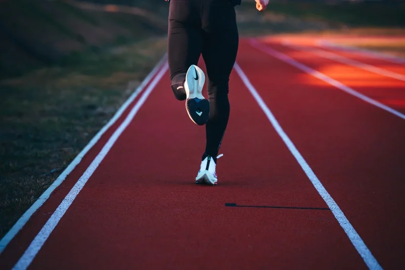 Photo of runner with nike logo on sole displayed