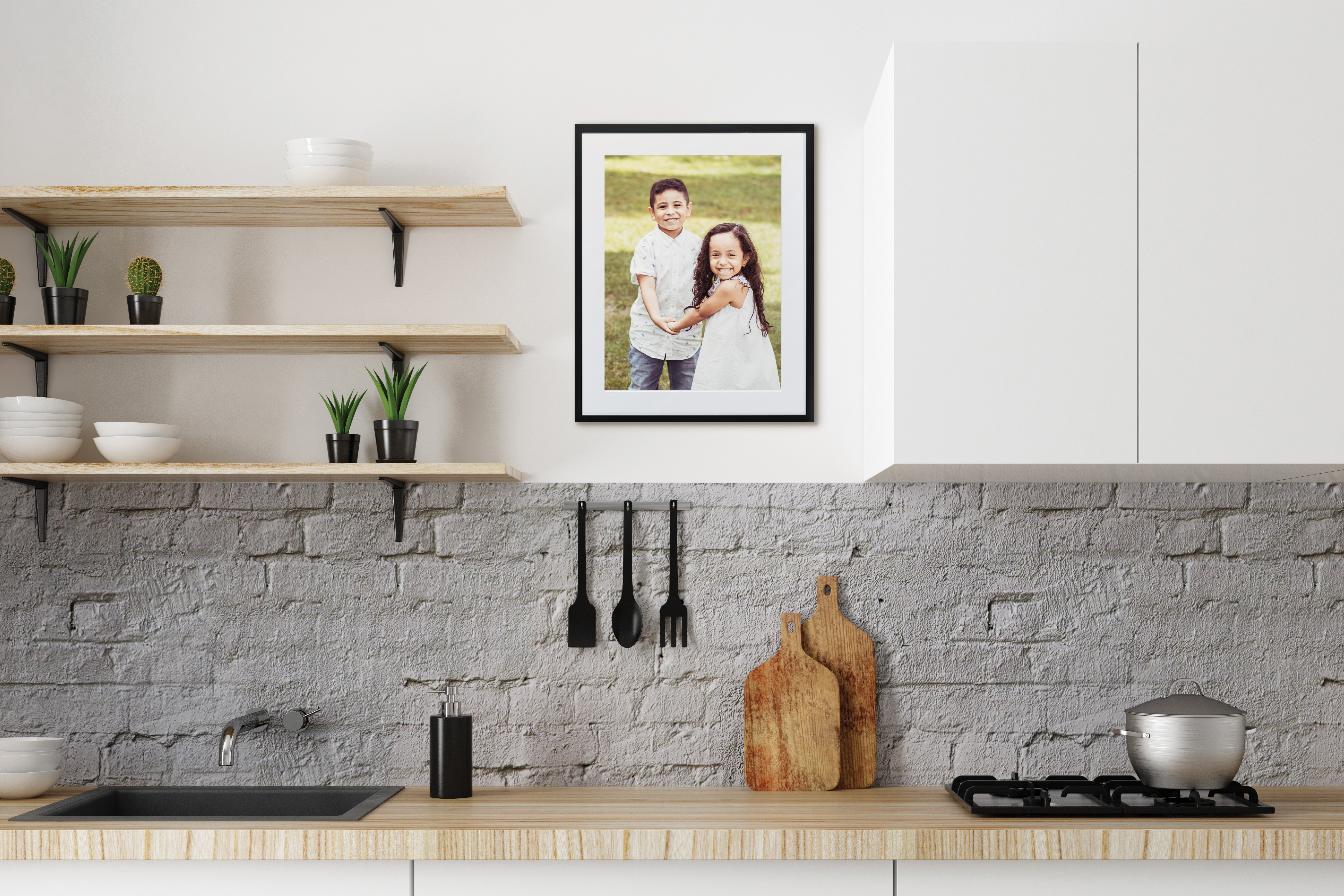 Framed print in kitchen of two friends holding hands