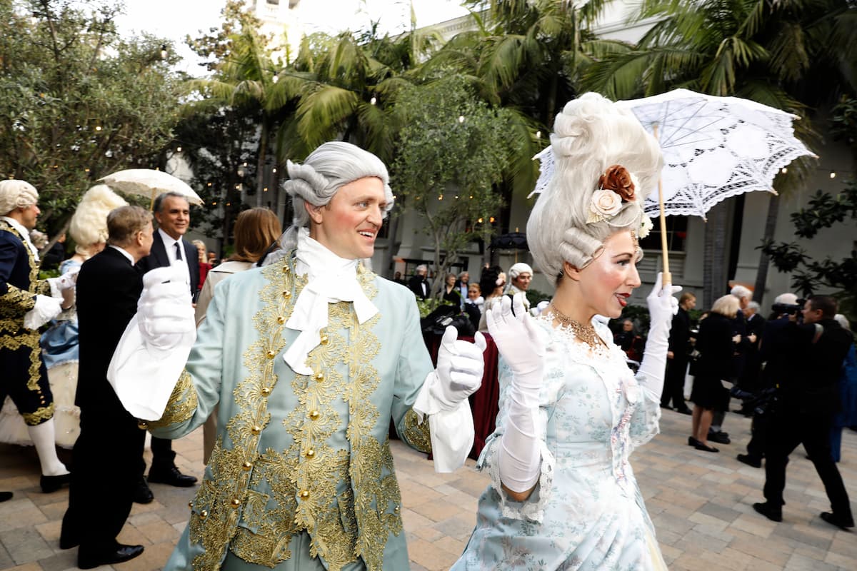 performers holding hands