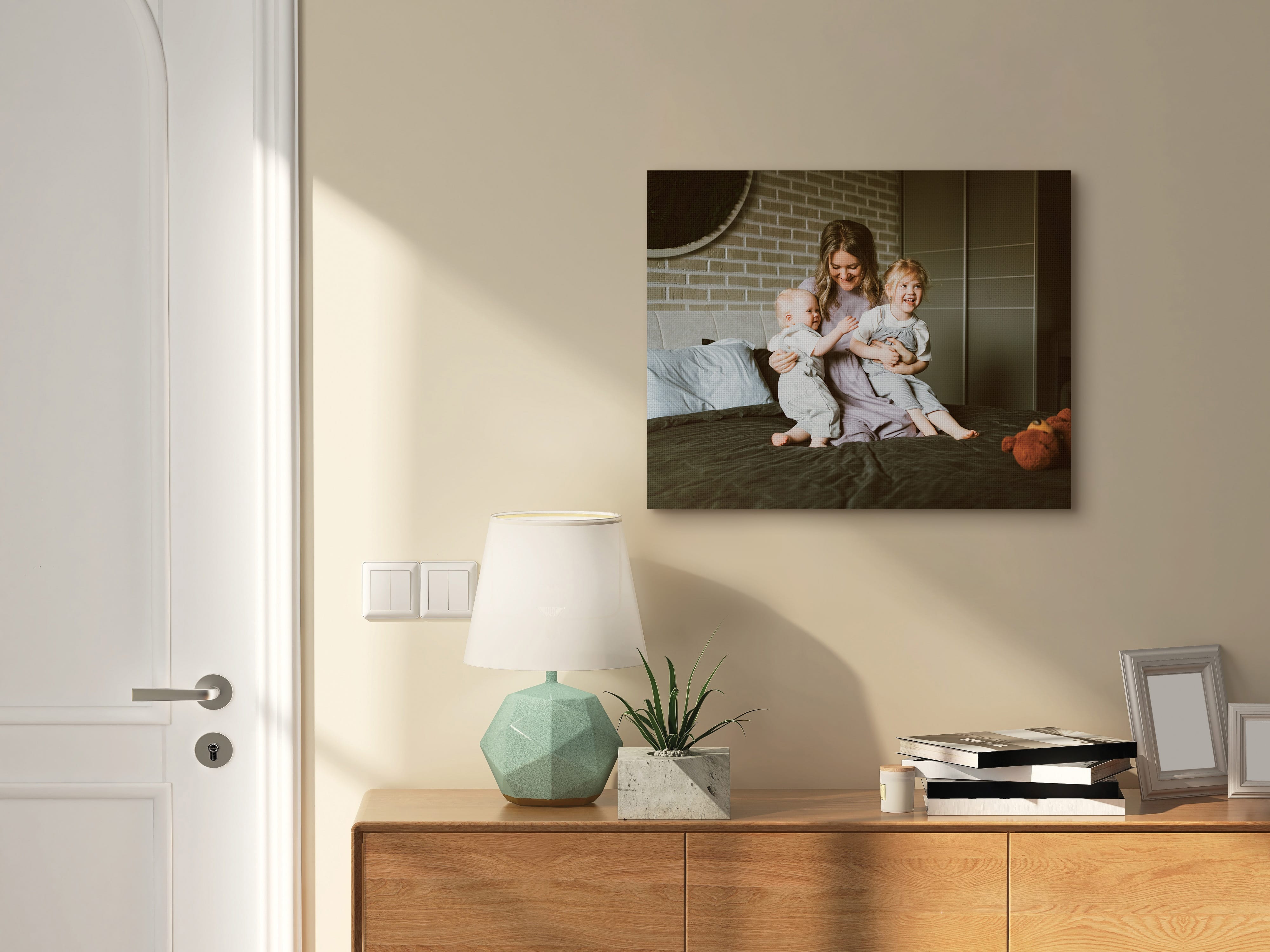 Canvas print above drawer of mother and her two children