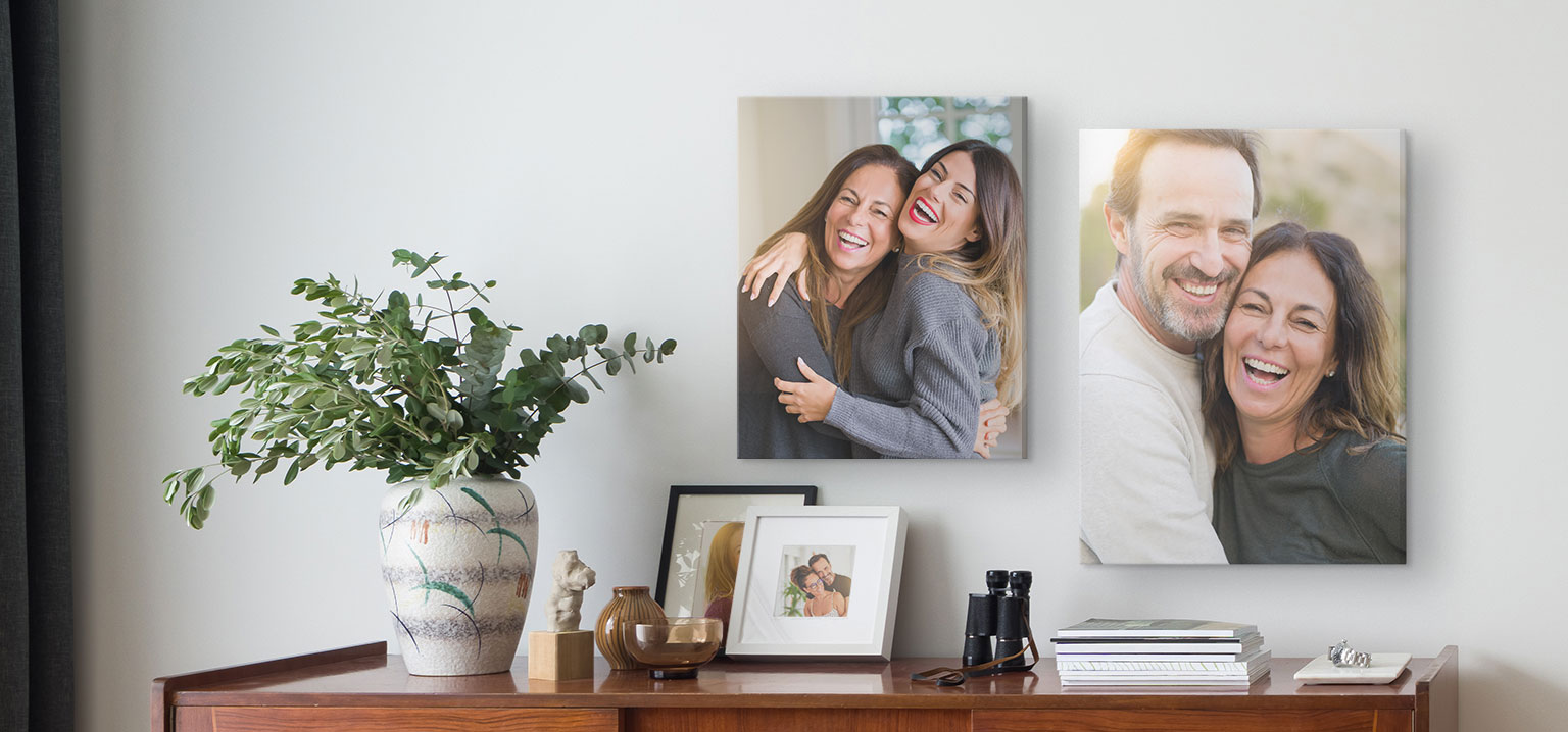 16x20 and 18x24 inch canvases showcase photos of a happy family laughing together