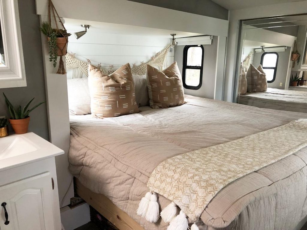Adding throw pillows and a blanket can change the overall look of your RV's bedroom.