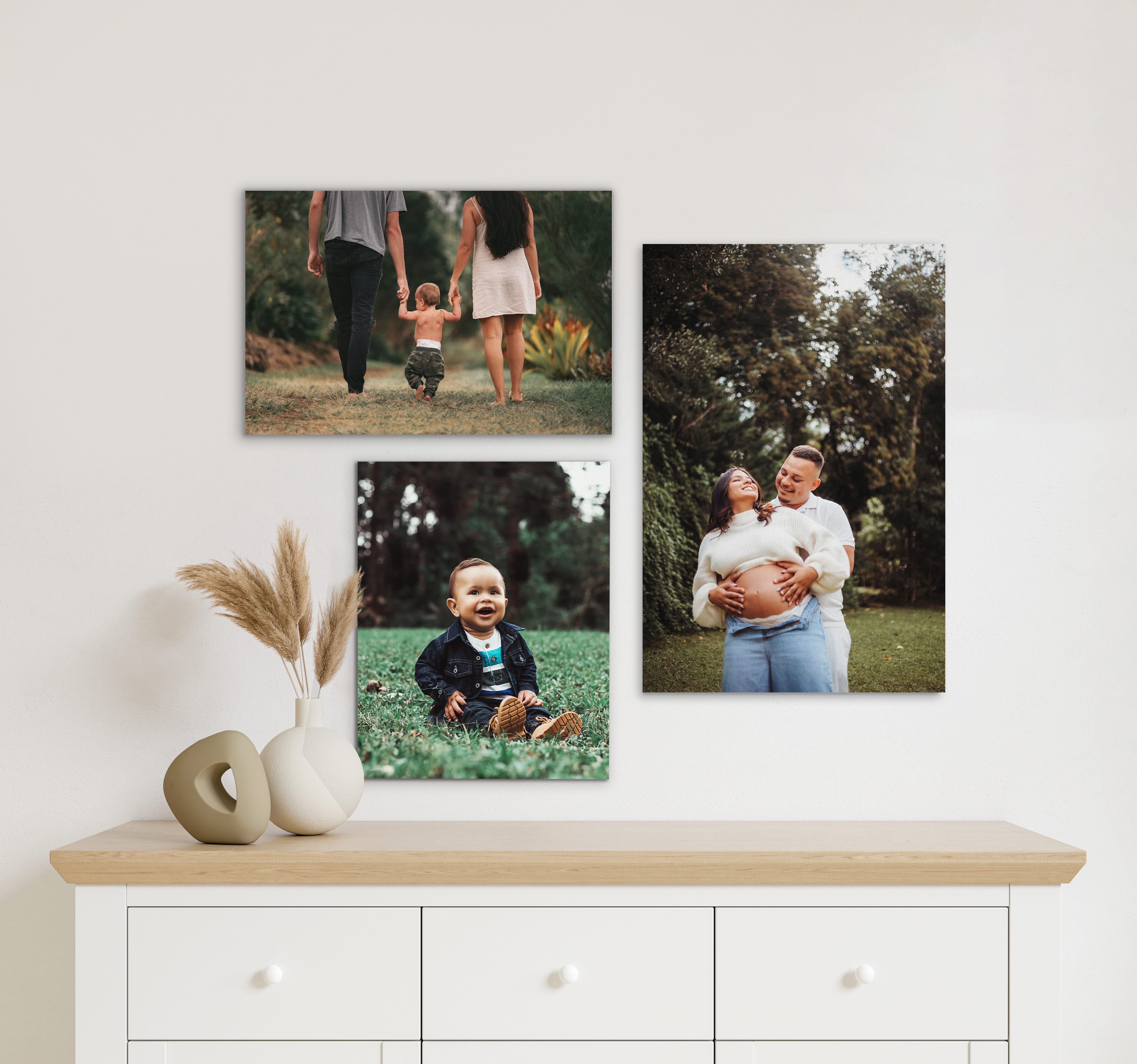 A gallery wall of canvas prints of family