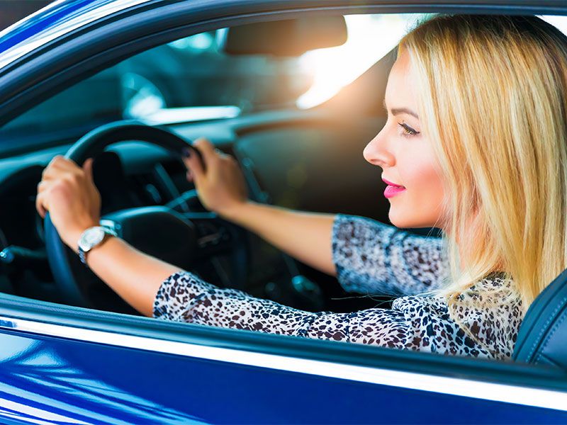 iStock woman driving new car 