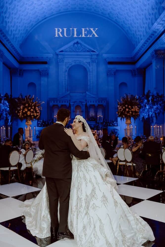 bride and groom dancing with blue lights