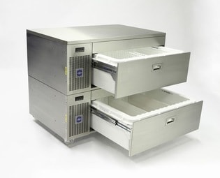 Commercial refrigerator drawers, with the drawers opened on slides