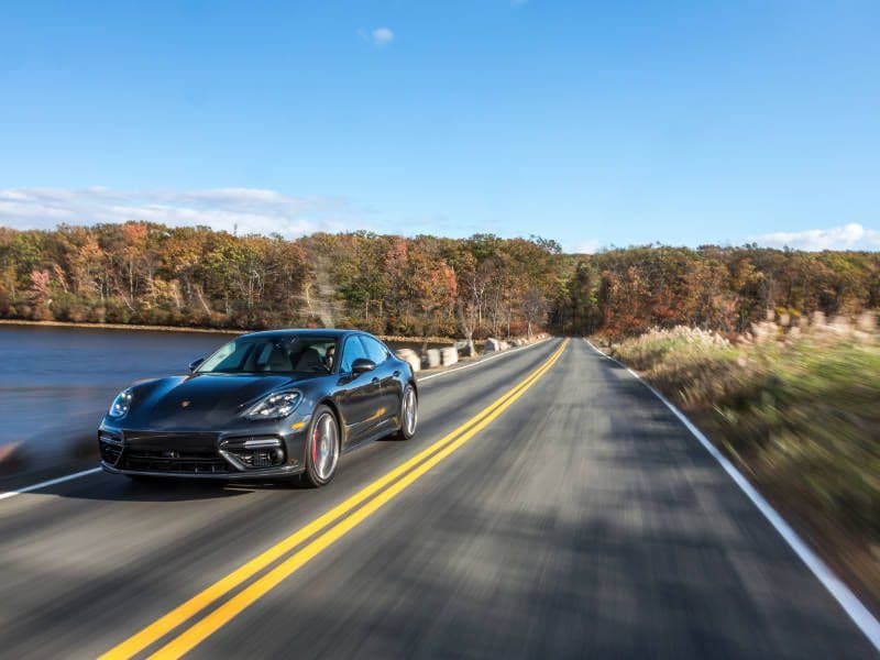 2017 Porsche Panamera front three quarter driving hero ・  Photo by Porsche 