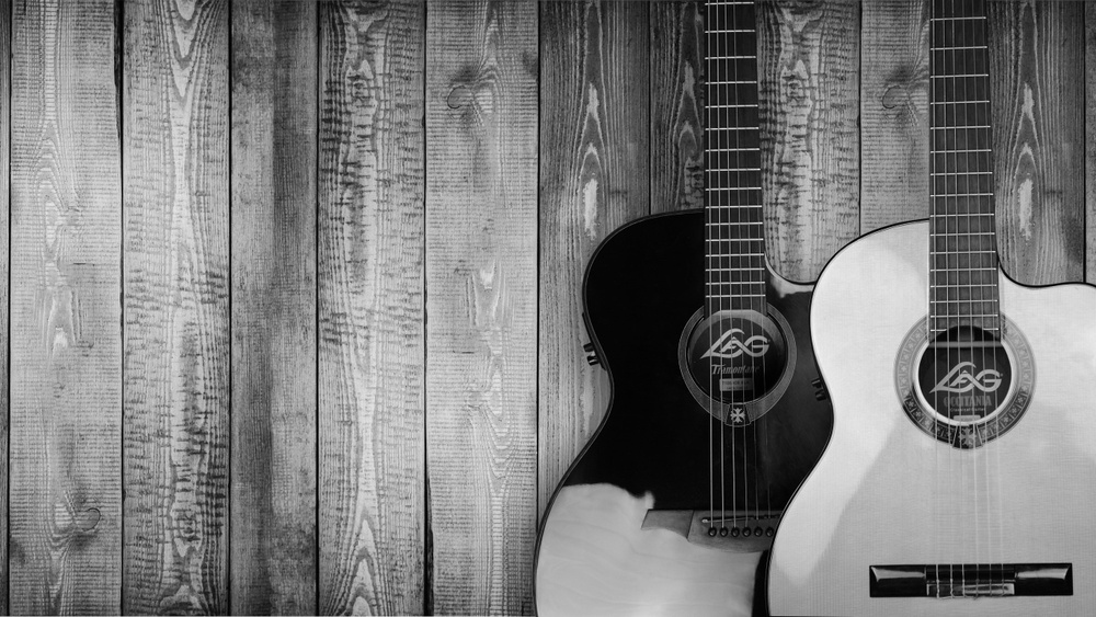 Two guitars white and gray 