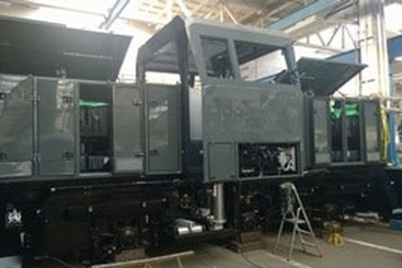 side view of train in factory about to have DA4160 heavy duty aluminium slide installed