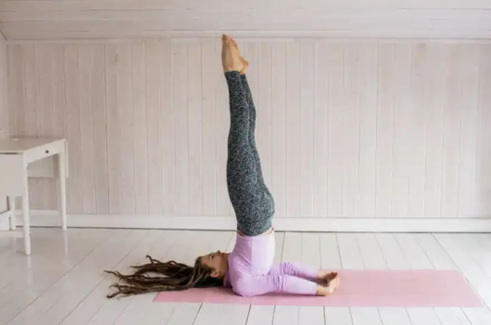 Sarvangasana with Variation (Shoulderstand with Hands Behind the Back)