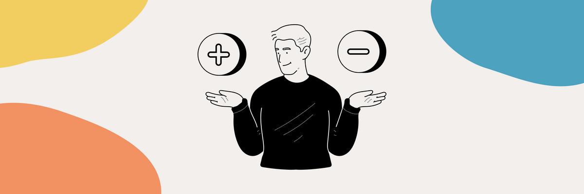 A person holding two coins with plus mark and minus mark