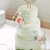 White layered rose wedding cake