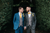 two grooms looking at each other in a bush
