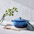 le creuset pot on marble placemat in white kitchen