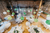 wedding tables with green and white lanterns in a barn