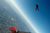 a man air diving in a red and blue suit