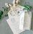 green regal floral wedding invite and envelope