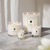 four jo malone candles in varied sizes