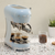 blue SMEG coffee machine on abstract marble tabletop