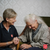 the salvation army carer laughing with an elderly lady 