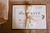 brown wedding invitation set tied with a bow