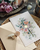floral wedding invite card with cream envelope