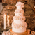 white edible flowers wedding layer cake