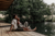 happy couple sitting on lake deck