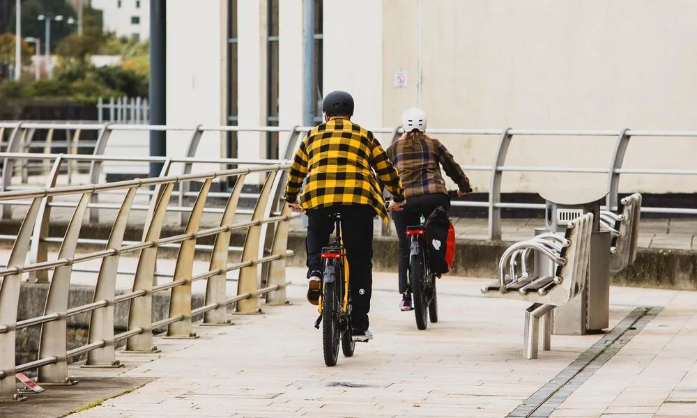 Riders riding two urban bikes