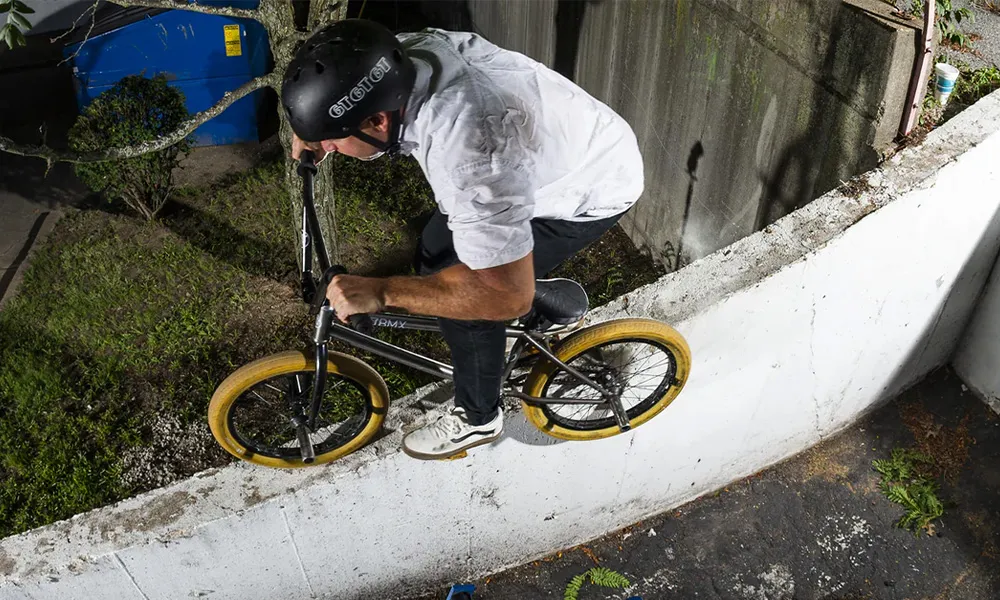 riding a gt bmx bike down a wall