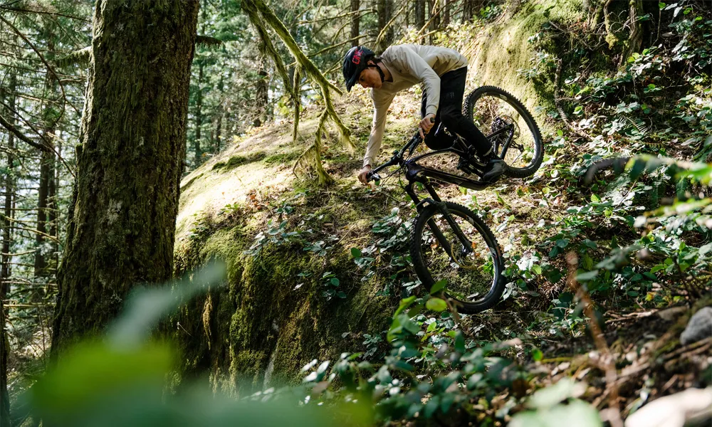 A GT mountain bike is ridden down a steep drop