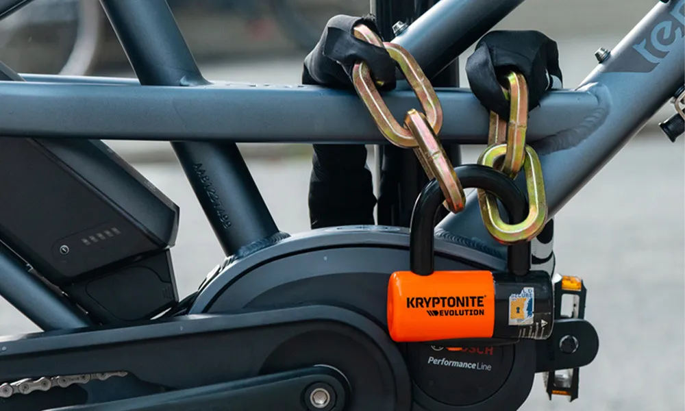 e-bike locked with a kryptonite padlock and chain