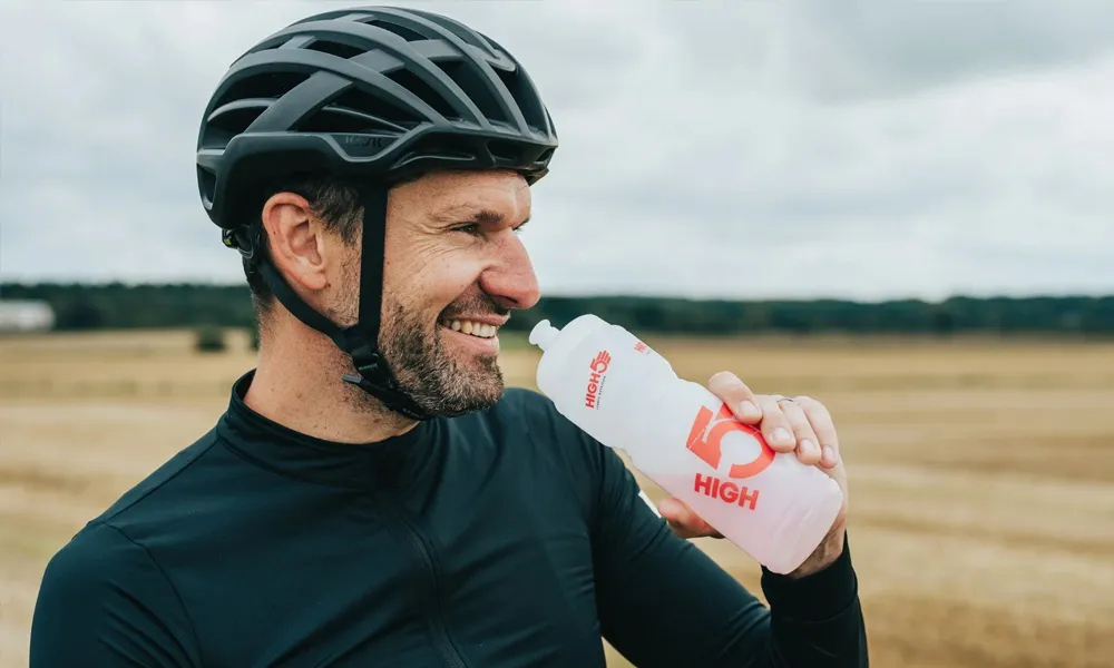 cyclist drinking from high5 bottle