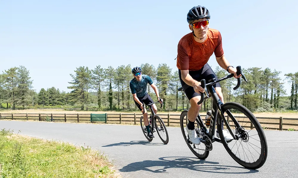 two road bikes are raced past 