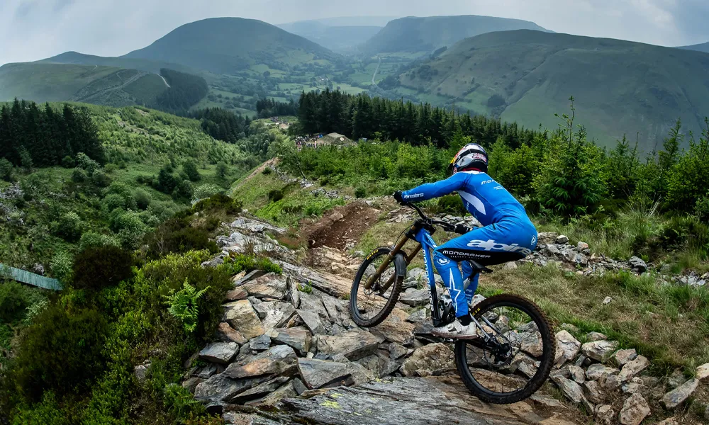 a Mondraker downhill bike is ridden on Hardline race track in North Wales