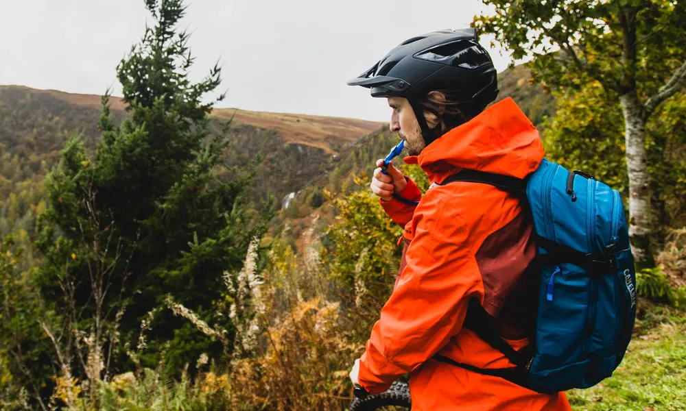 drinking from a hydration pack camelbak