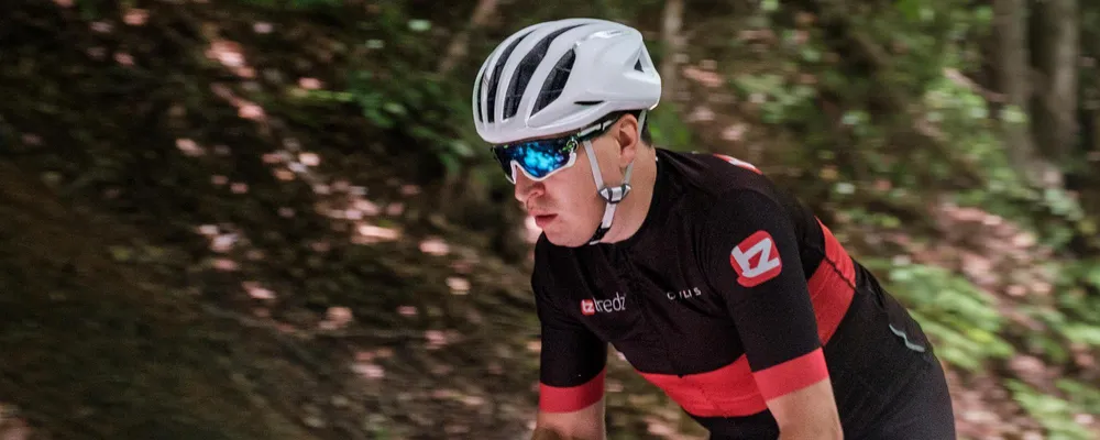 road cyclists close up wearing glasses adn helmet