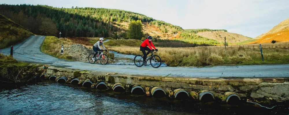 two cyclists riding down from the Devils Staircase in Wales