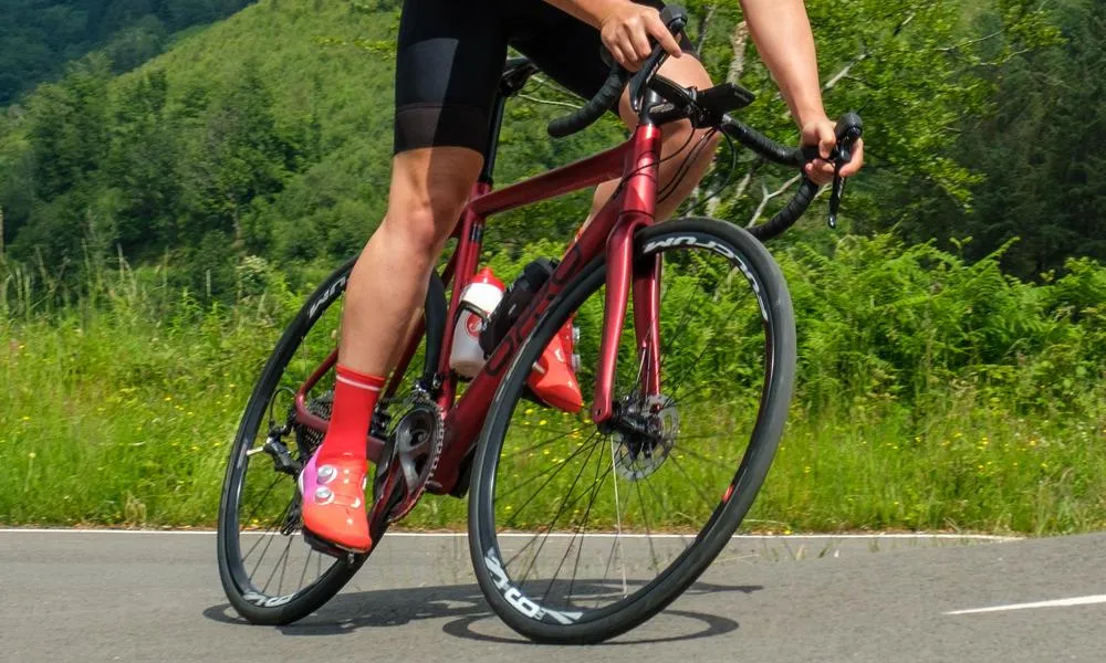 climbing a road bike on a warm summer day