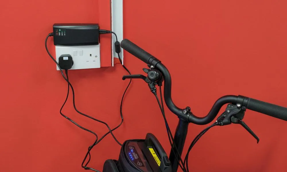 close up of a Brompton ebike charging