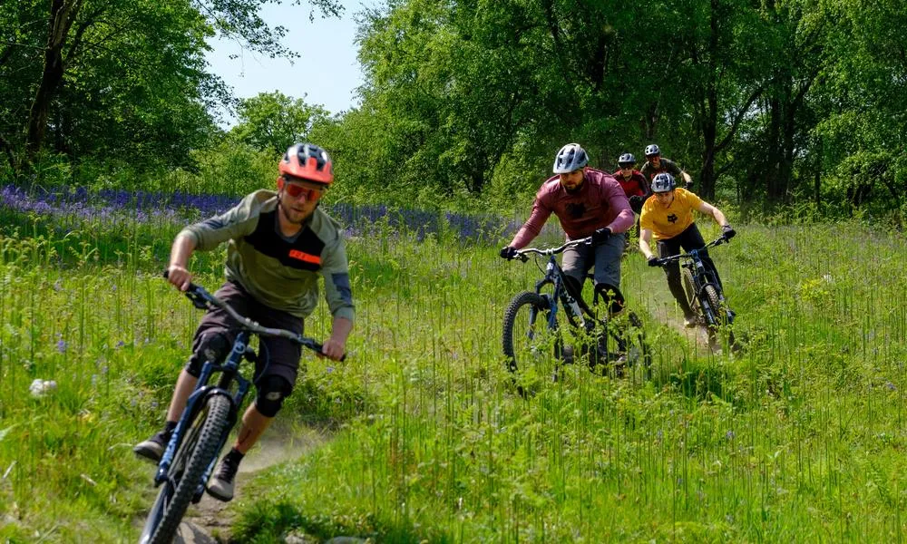 MTB riders descending down a hill