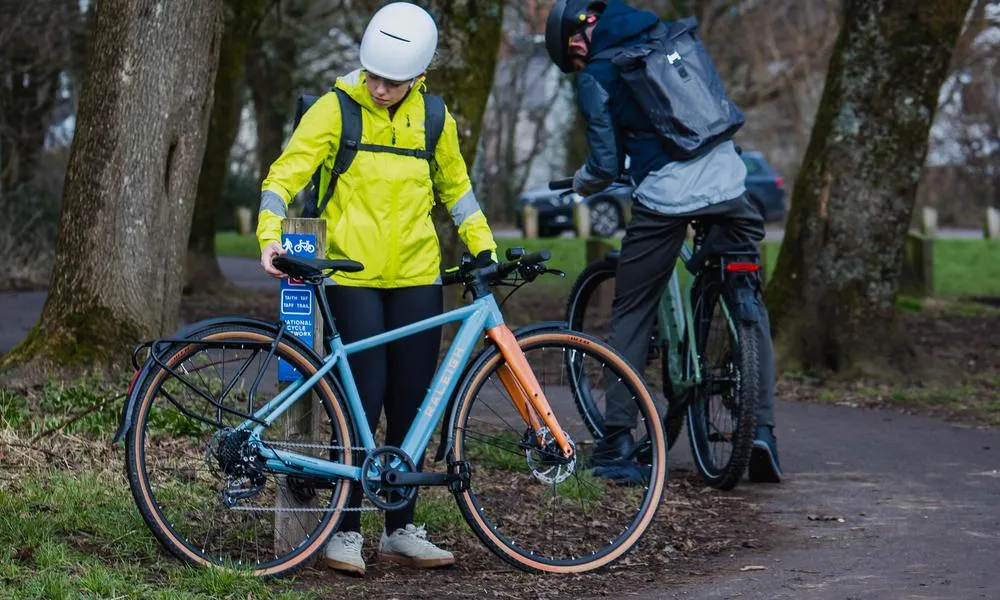 Cyclist looking at their urban e-bike