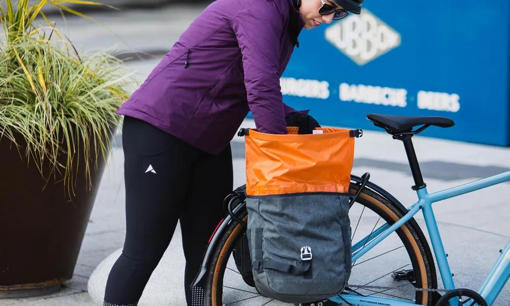 loading a pannier bag on a bike